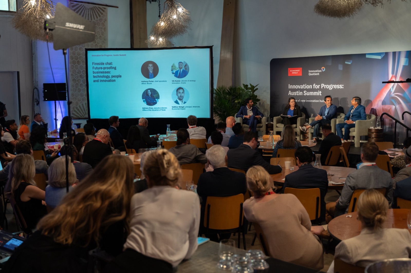 Audience at the Economist Impact Austin Summit fireside chat featuring Vivek Kumar of Oracle