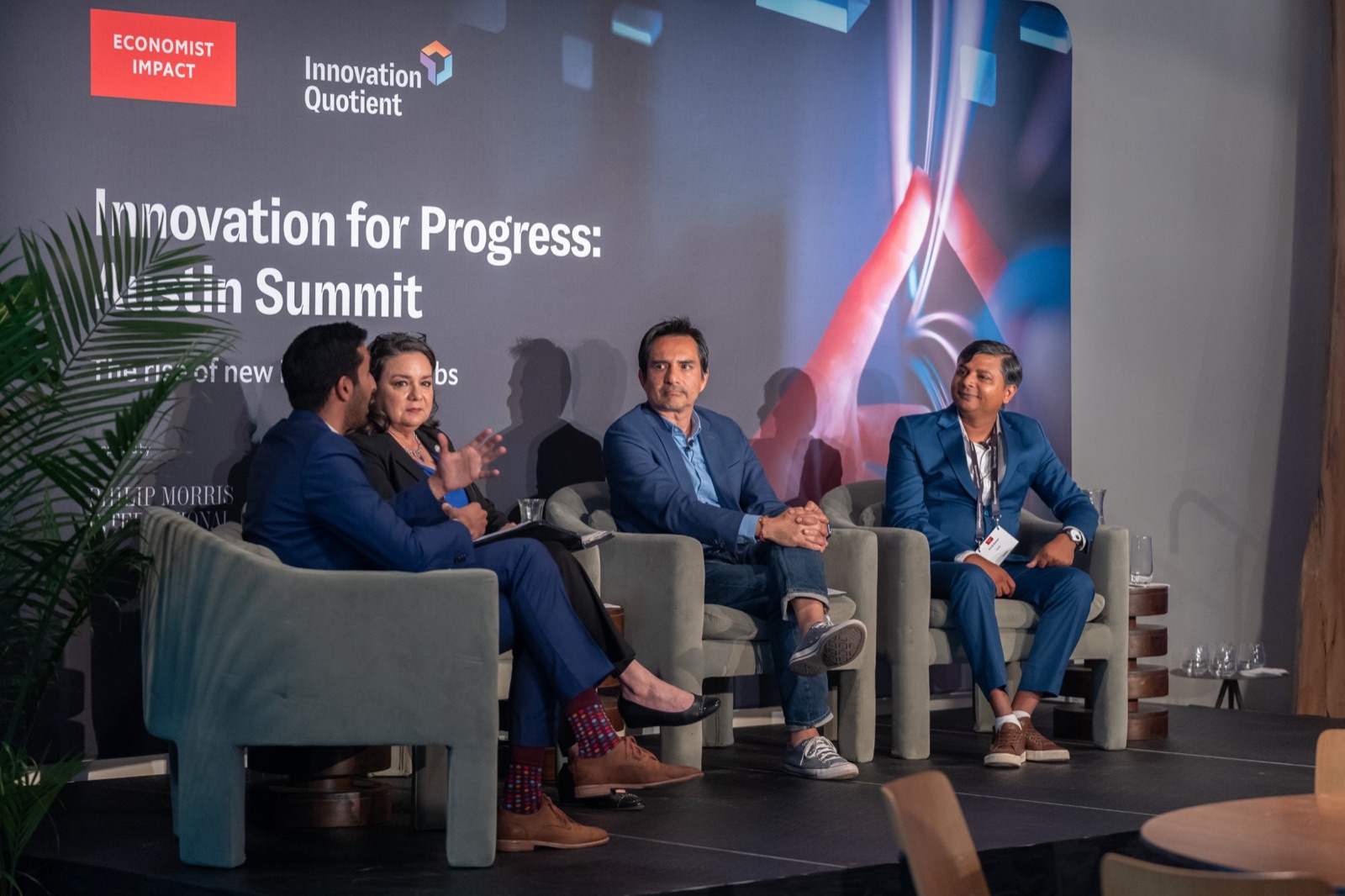 Vivek Kumar on stage with fellow panelists at the Economist Impact Innovation for Progress: Austin Summit